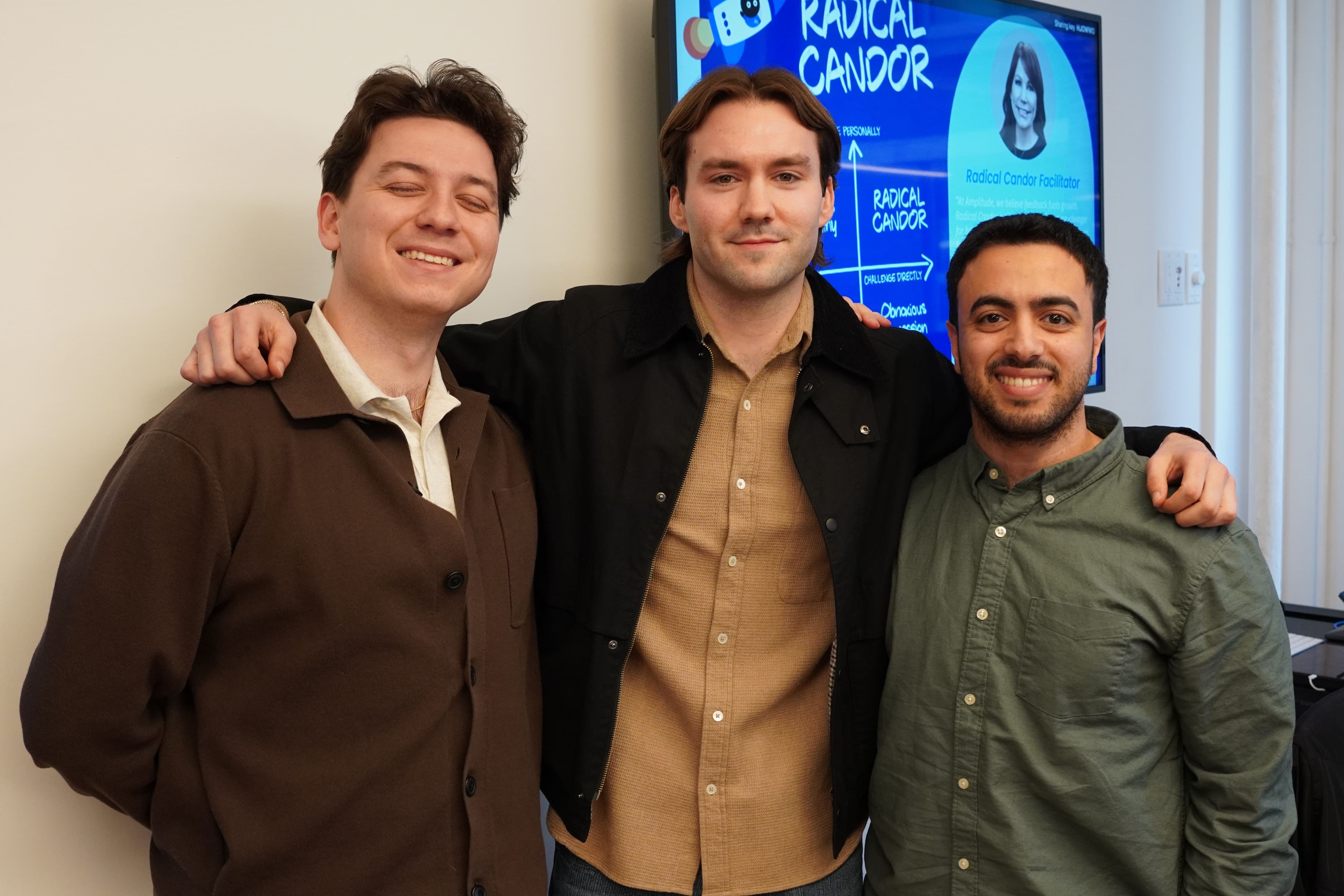 Three Ampliteers smile