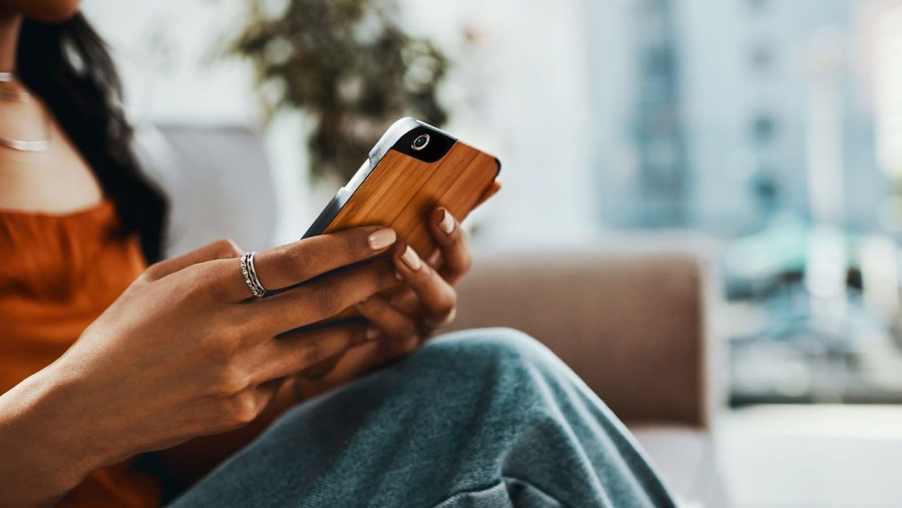 A lady holding a phone