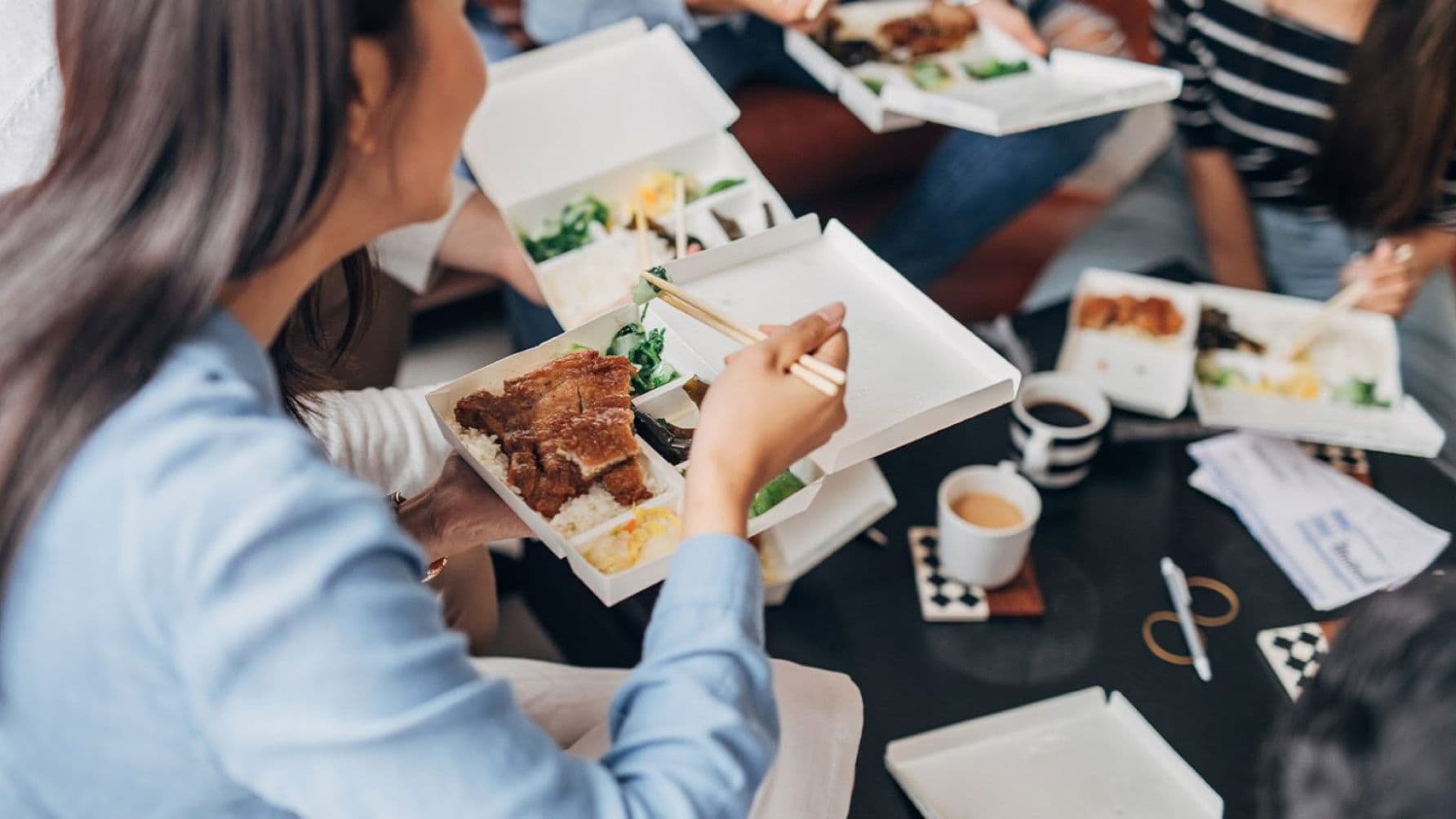 People sharing yummy meals on the table
