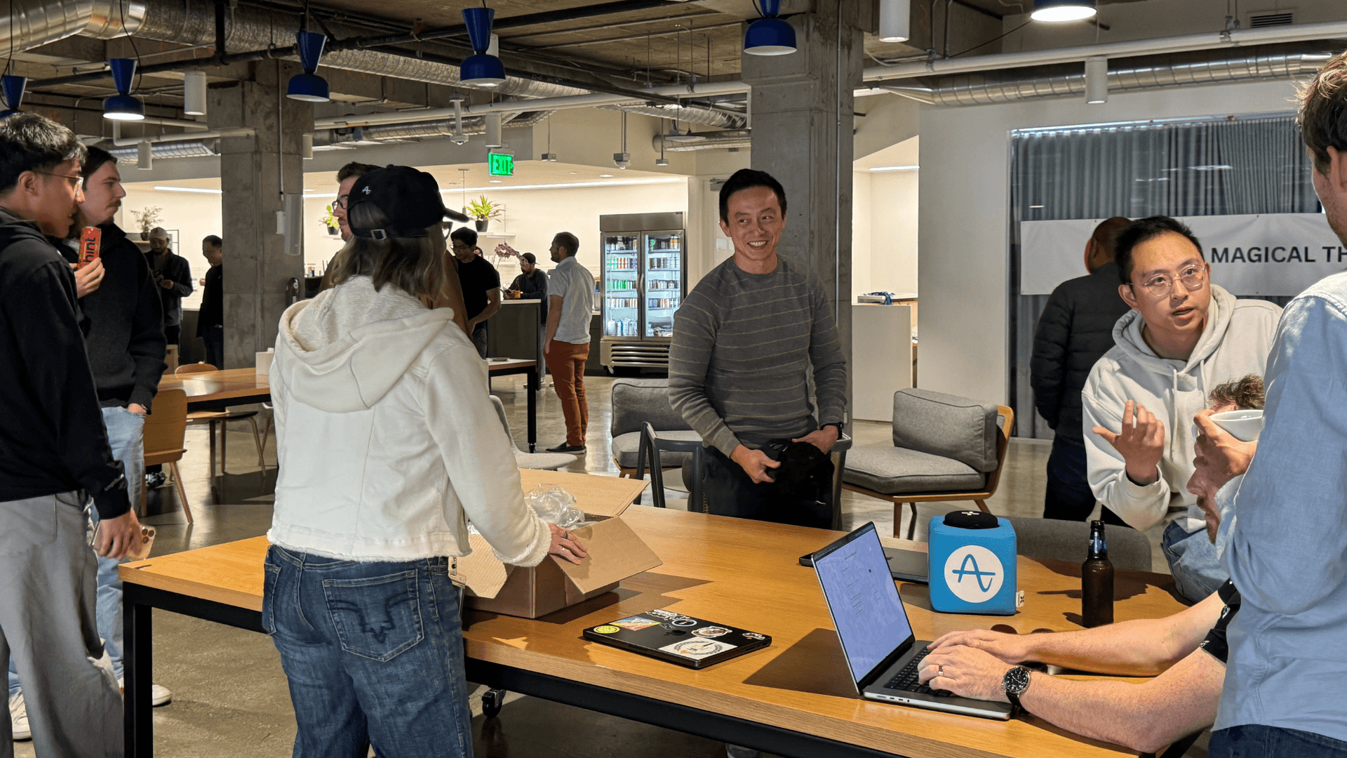 Amplitude engineers, designers, and product team members collaborate on their AI Week projects