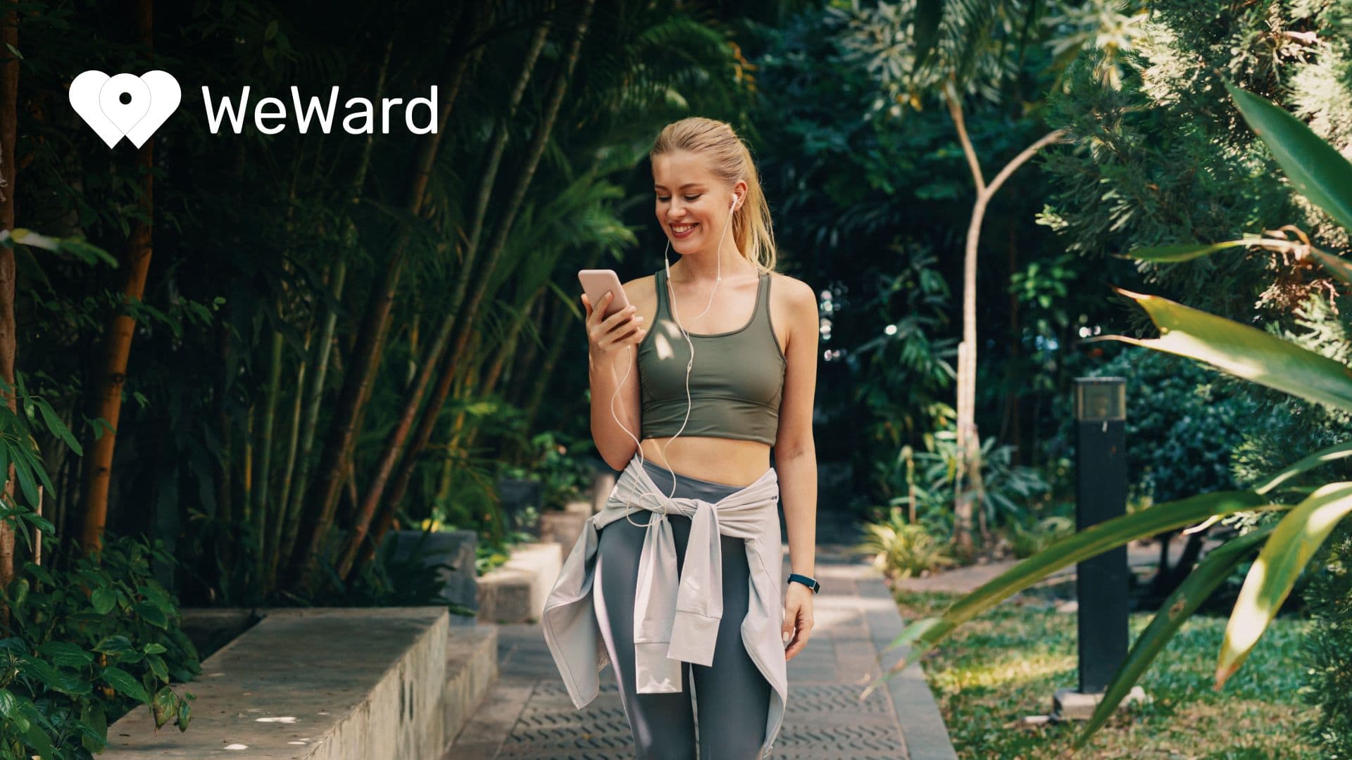 WeWard usage: a smiling woman out for a walk looks at her phone
