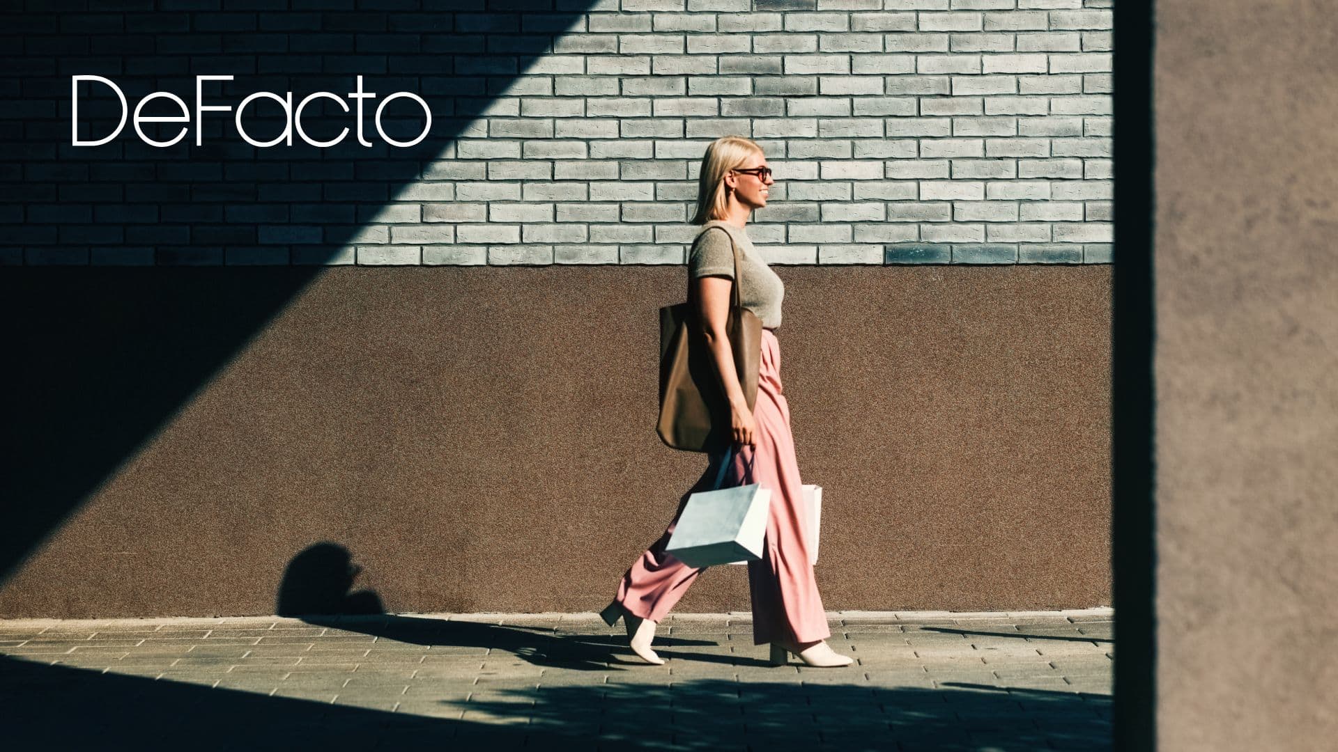 Woman walking with shopping bags