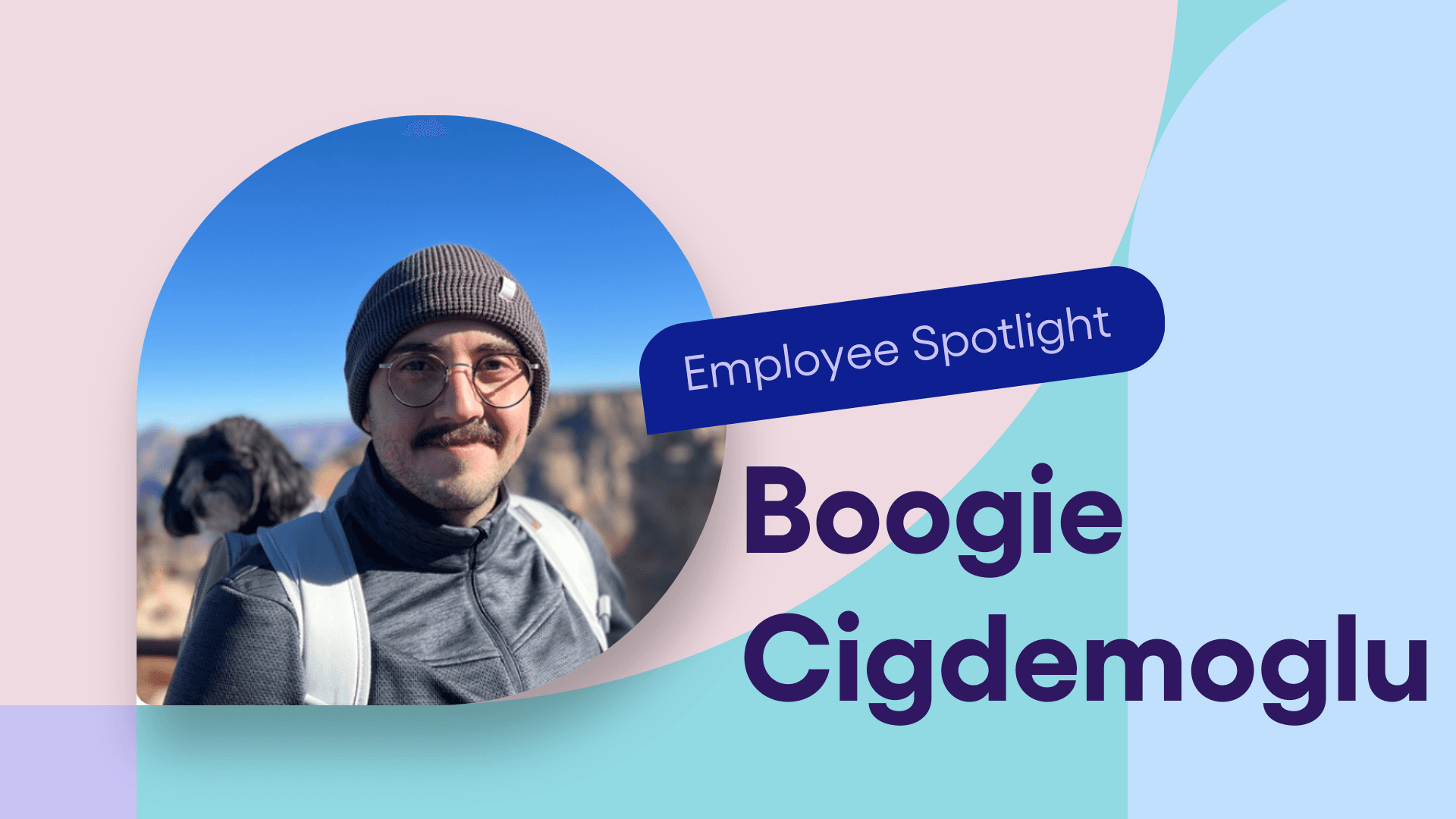 Ampliteer Boogie Cidgemoglu smiles with a puppy in his backpack