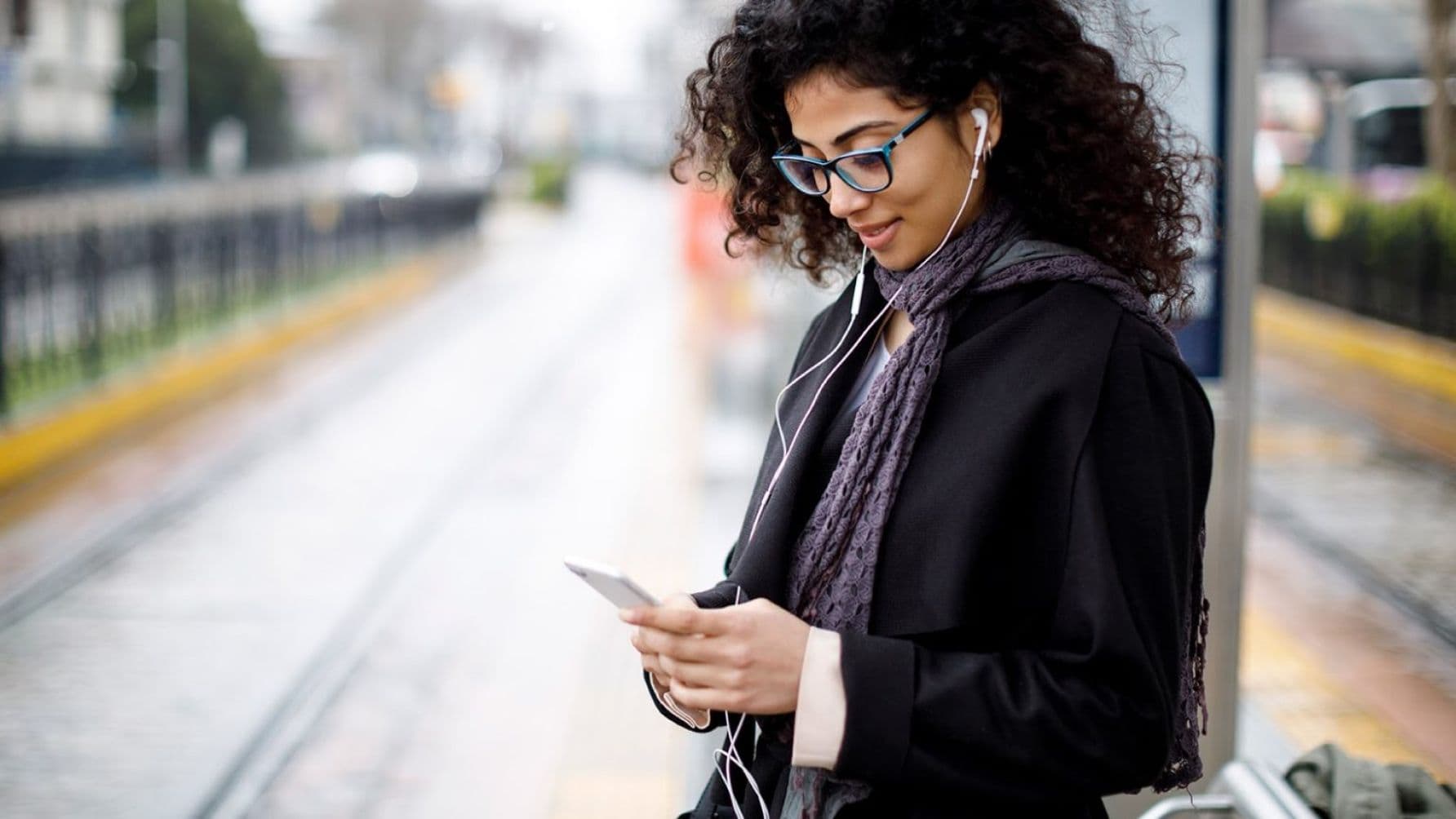 a lady using her smartphone looks happy
