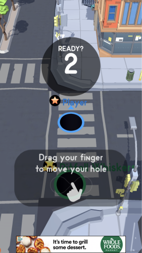 *Mobile game Hole.io’s simple onboarding message.*