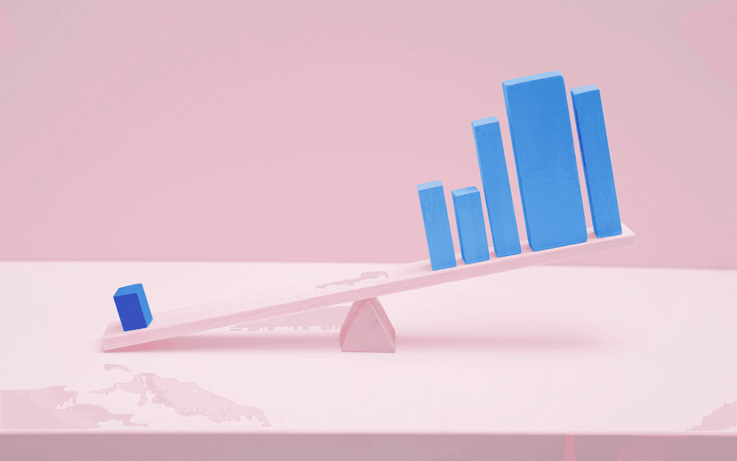 Seesaw image with one bar on one side and many bars on the other