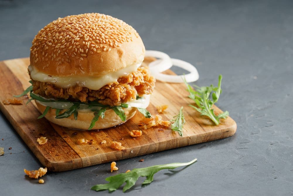 yummy chicken sandwich on a chopping board